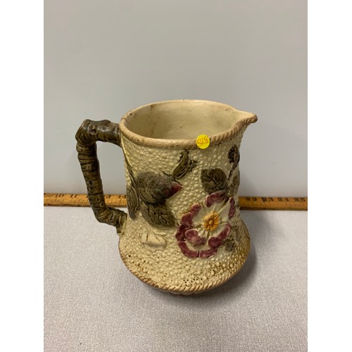 107 - Vintage Majolica jug with floral design. 18cm tall