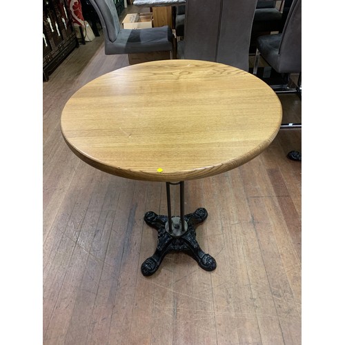 76 - Pine top table of cast iron base.
70cm h x 60cm diameter