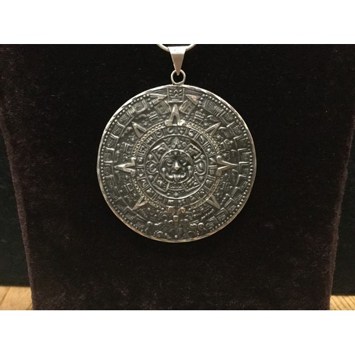 116 - Large Mexican/Mayan silver chain and pendant -Measoamerica games on one side and Mayan calendar on o... 