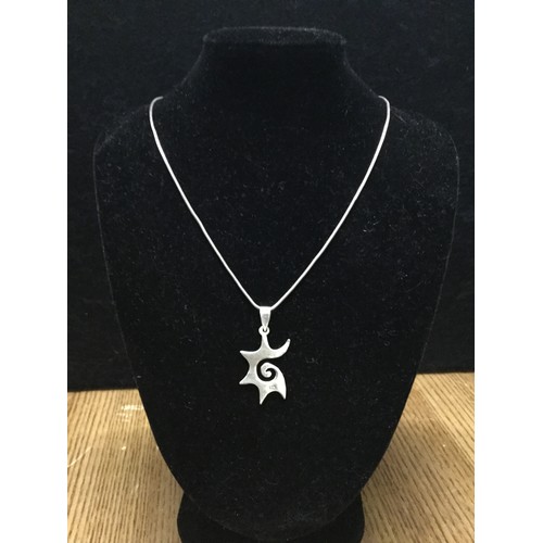 120 - Hallmarked silver chain with silver abstract design pendant.