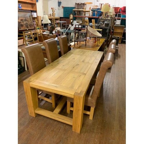 126 - Extremely large Solid oak dining table with 6 matching tan leather dining chairs. L 240cm x W 100cm.