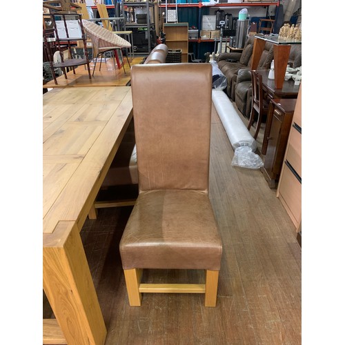 126 - Extremely large Solid oak dining table with 6 matching tan leather dining chairs. L 240cm x W 100cm.