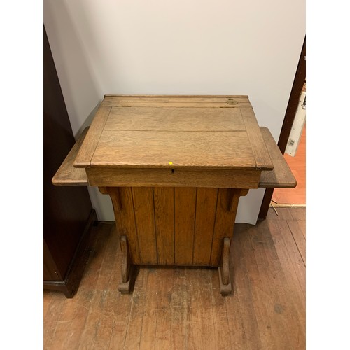 223 - Antique teachers desk or lectern by the Bennet furnishing company London and Glasgow. H 103cm x W 92... 