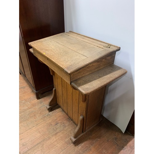 223 - Antique teachers desk or lectern by the Bennet furnishing company London and Glasgow. H 103cm x W 92... 