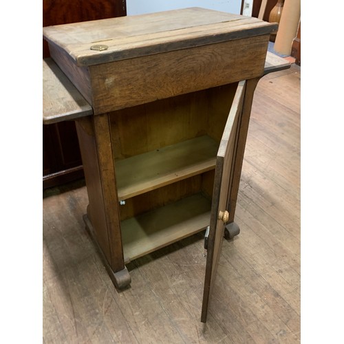 223 - Antique teachers desk or lectern by the Bennet furnishing company London and Glasgow. H 103cm x W 92... 