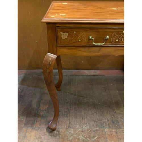 471 - Solid wood table 2 drawer table with floral design brass inlay on Queen Anne legs.
77cm h x 104cm h ... 