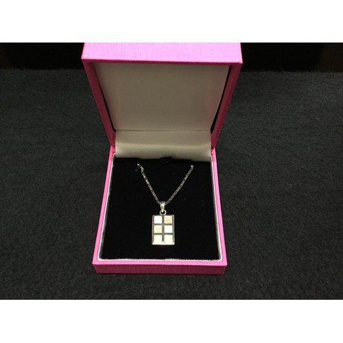 514 - Hallmarked silver and mother of pearl pendant and chain.