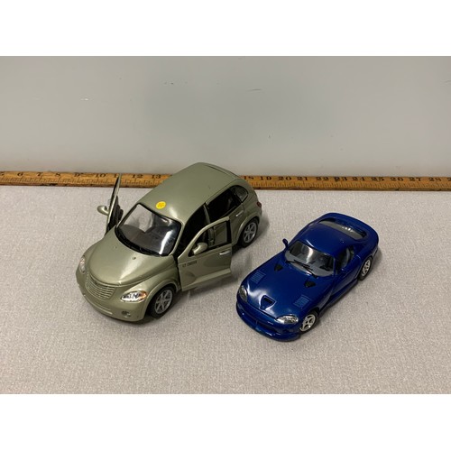 601 - 2 x Die-cast model cars.