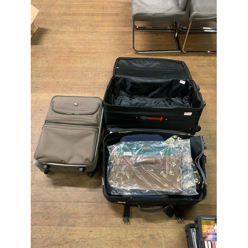 715 - Suit cases and bags