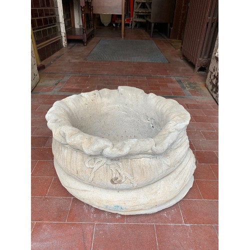 39 - Stone garden sack planter.