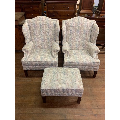 32 - Pair of Parker Knoll wing back arm chairs with matching footstool.