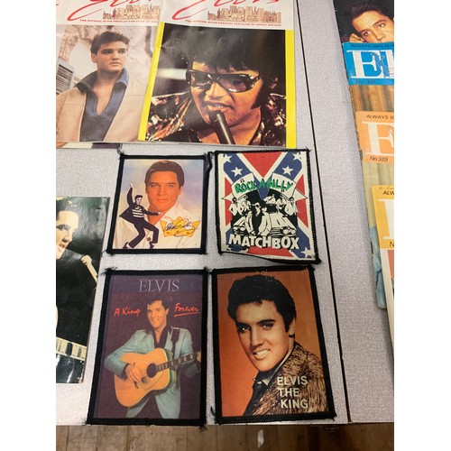 81 - Collection of Elvis memorabilia to include fan club magazines, commemorative coin and framed picture... 