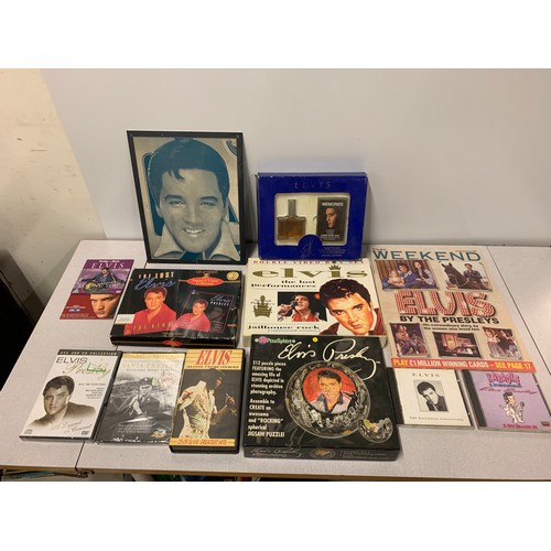 82 - Collection of Elvis memorabilia to include dvds, cd's and boxed aftershave set etc.