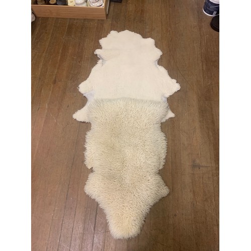 83 - 2 x Sheepskin rugs.