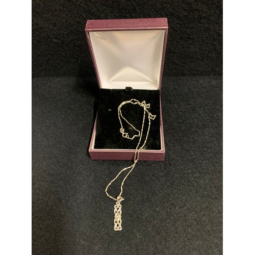 107 - Hallmarked silver chain and rennie mackintosh pendant.