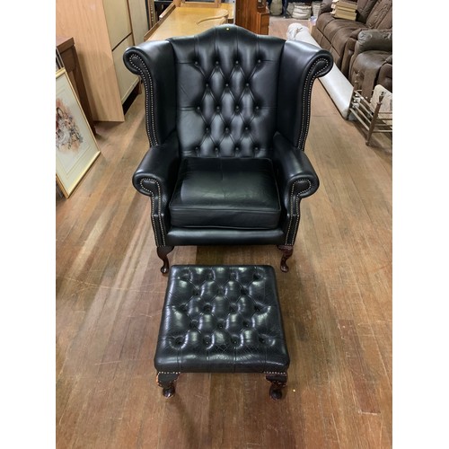 93 - Black leather Chesterfield, wing back chair and stool.