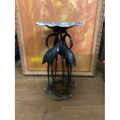 131 - Vintage cast metal bird bath depicting 3 flamingos holding up a flower head. 76cm tall.