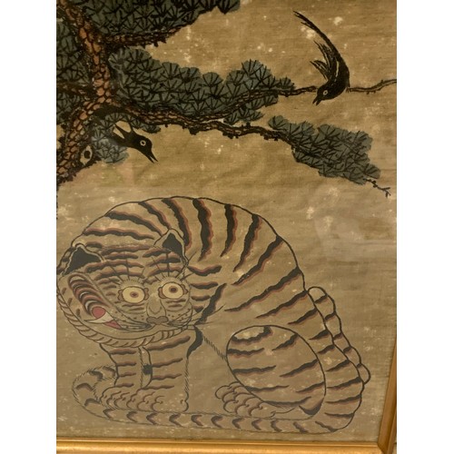 187 - Late 19th century Korean Minhwa tiger and magpie painting of silk in frame.