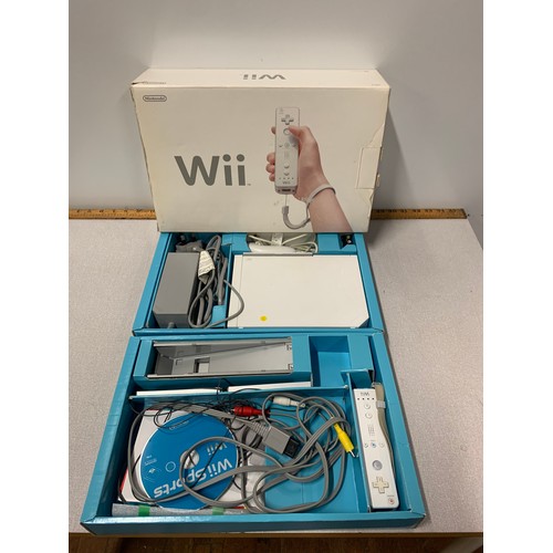 696 - Boxed Nintendo Wii with accessories.