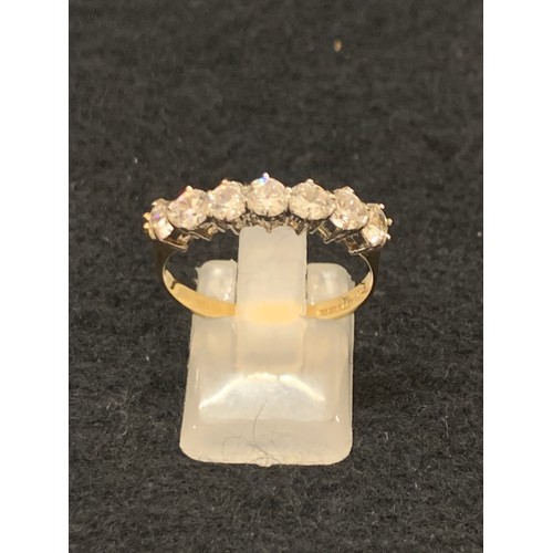 115 H - 9ct gold eternity ring with multiple white gem stones.
2.3g