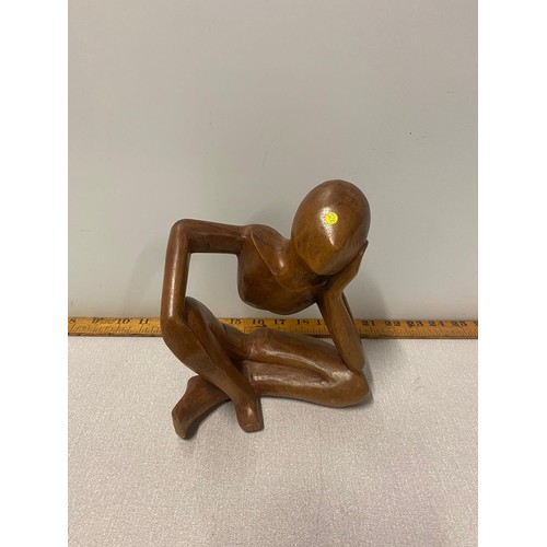 7 - Carved wooden statue of sitting man.
20cm Tall