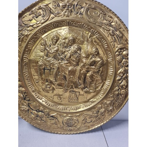 49 - Large brass wall hanging shield with crossed swords depicting mythical scene Circa 1930's along with... 