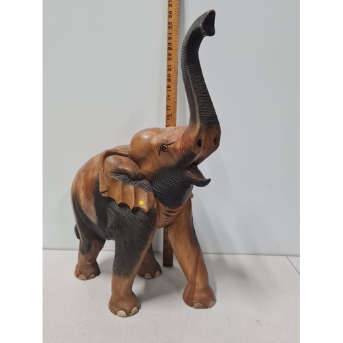 55 - Large heavy carved wooden elephant statue.
59cm Tall