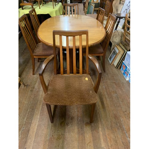 108 - Mid century G-Plan dining table and 6 chairs to include 2 carvers. Small rip to the upholstery on on... 