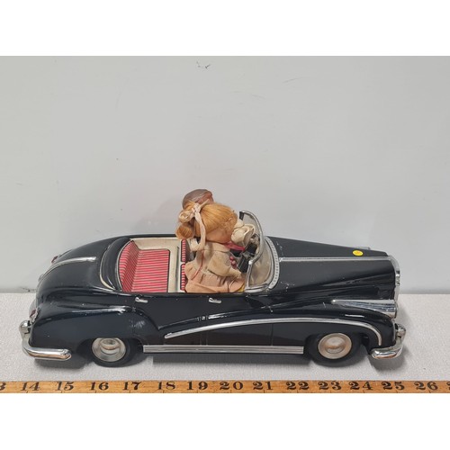 61 - Vintage metal electric car with figures in working order.
Approx 31cm Long