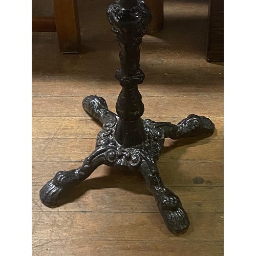 132 - Victorian wrought iron table base with wooden barrel top.