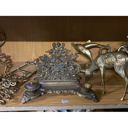 142 - Shelf of vintage brass ware to include horse and deer figures etc.