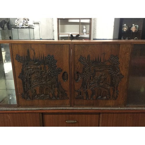 210 - Pair of solid wood glass fronted cabinets with Oriental scene carved into the front and carved drago... 