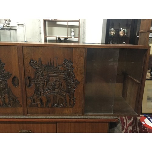 210 - Pair of solid wood glass fronted cabinets with Oriental scene carved into the front and carved drago... 