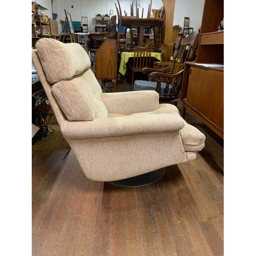 295 - Retro pieff swivel arm chair.