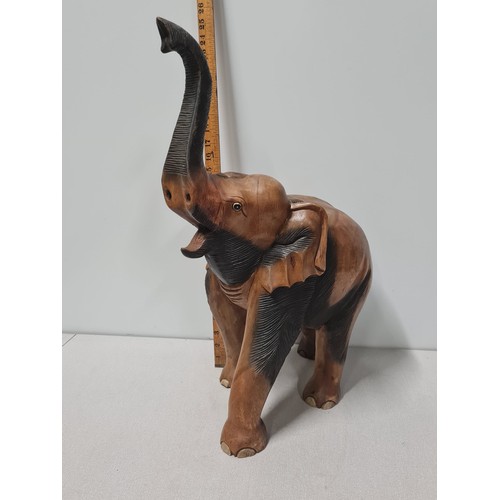 55 - Large heavy carved wooden elephant statue.
59cm Tall