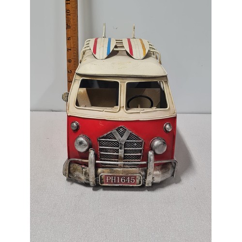 53 - Large metal model van with surfboards on roof.
Approx 40cm Long