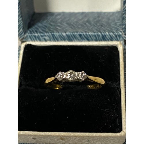 340 - 18ct gold and platinum ring encrusted with 3 diamond chips.