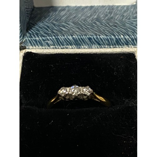 340 - 18ct gold and platinum ring encrusted with 3 diamond chips.