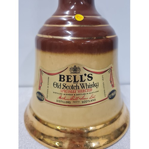 11 - Bells Old Scotch Whisky in Wade decanter full and sealed (70 proof)