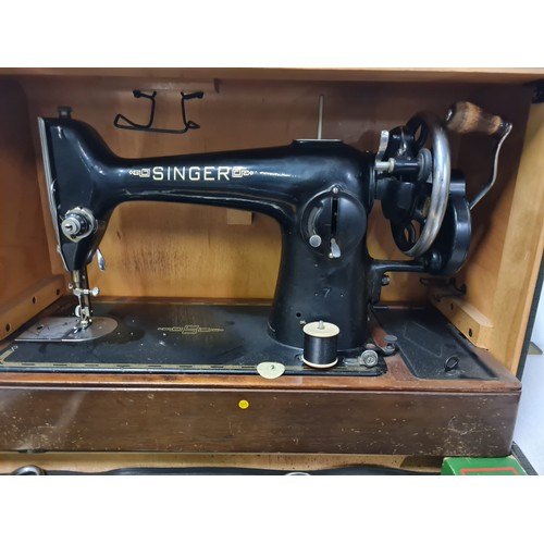 40 - Vintage Singer sewing machine in carry case with Singer rubber mat and shears.