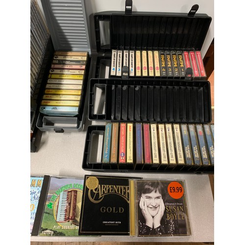 73 - Large collection of vintage music cassettes and cd's.