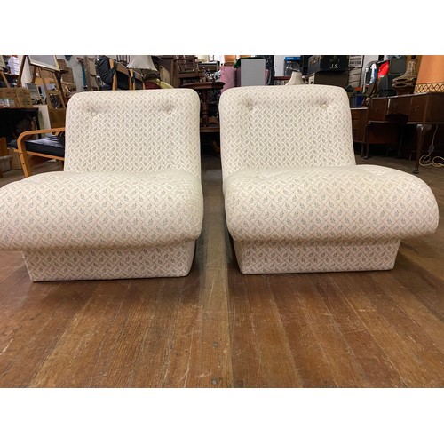 79 - Pair of vintage upholstered lounge chairs.