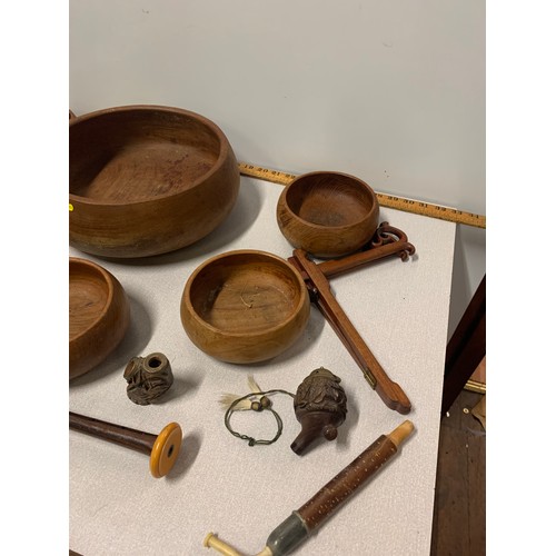 93 - Set of 7 Thai teak bowls along with carved wooden pipes etc.