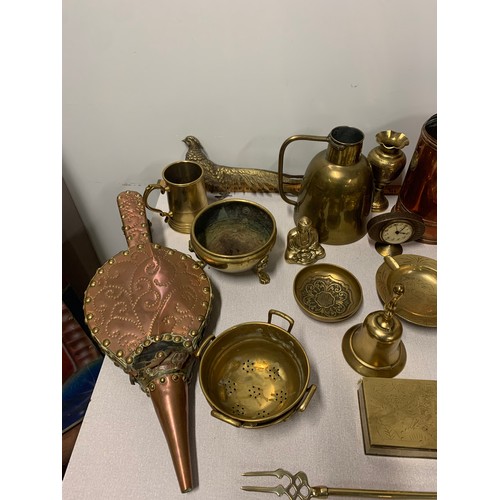 96 - Collection of brass items to include tankards, bell, dishes and figures etc.