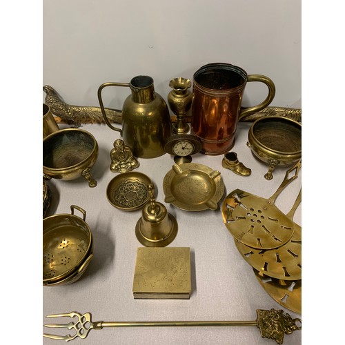 96 - Collection of brass items to include tankards, bell, dishes and figures etc.