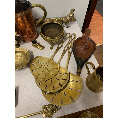 96 - Collection of brass items to include tankards, bell, dishes and figures etc.