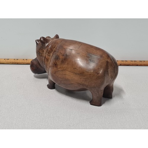 131 - African hand carved solid mahogany hippopotamus ornament.
23cm Long