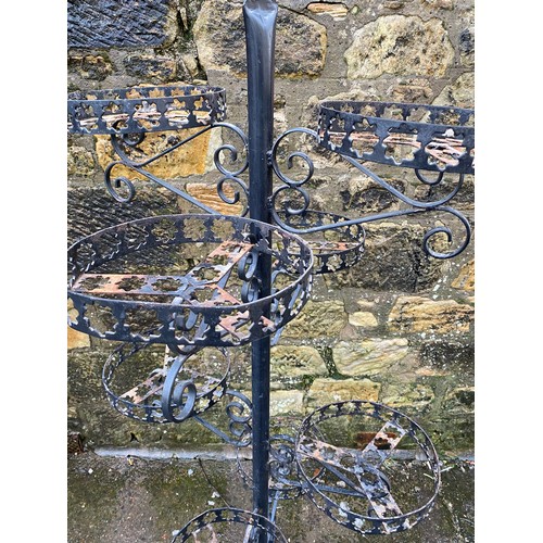 156 - Large ornate wrought iron garden flower basket holder with 8 basket holders.
Approx 188cm Tall