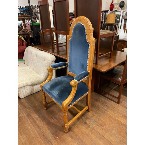 160 - Solid oak throne chair with blue velvet upholstery.