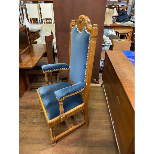 161 - Solid oak throne chair with blue velvet upholstery.